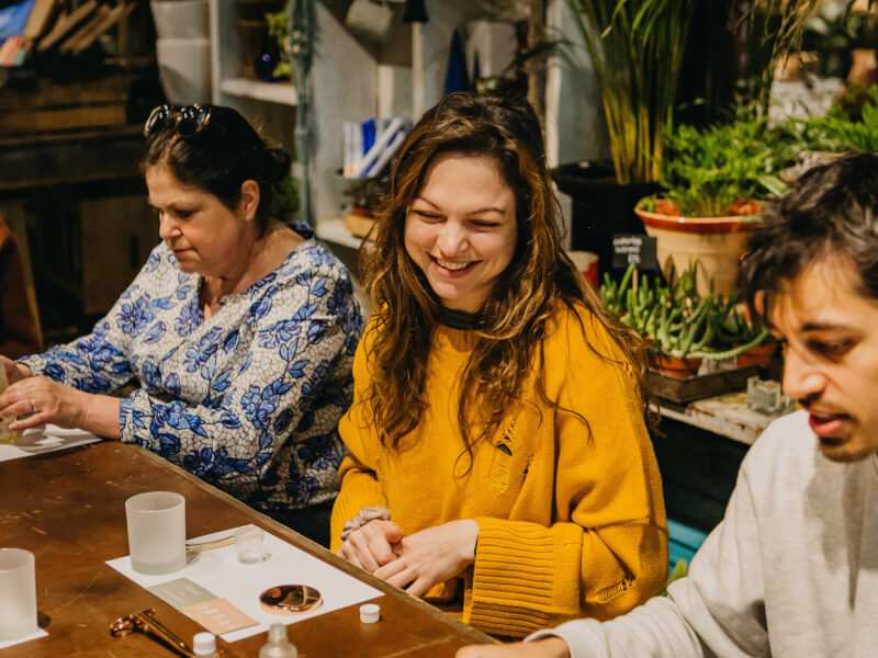 woman smiling at candle making class